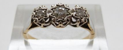 An 18ct gold ring set with three diamonds in a platinum illusion setting, size N, 2.