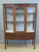 A glazed early 20thC display cabinet with single draw below,