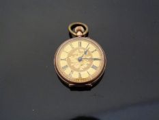 A 9ct gold ladies keyless winding open faced pocket watch with engraved self coloured face,