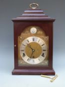 Elliott three-train shelf/bracket style clock in dark wood-stained case.