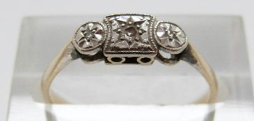 A 9ct gold ring set with three diamonds in a platinum setting, size N, 1.