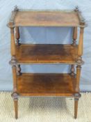 A 19thC continental walnut and mahogany and three tier whatnot with gilt mounts,
