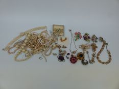 A collection of costume jewellery to include brooches,