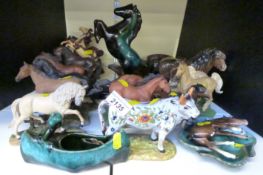 A large collection of Danbury Mint, Heredities and Beswick foals,