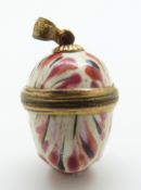 A Bilston Enamel egg pendant with gilt metal mounts,