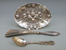 A white metal oval pin dish,