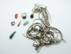 Ten silver chains/ necklaces, a silver St Christopher, two silver heart shaped pendants,