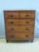 A 19thC bow front chest of two over three graduated drawers,