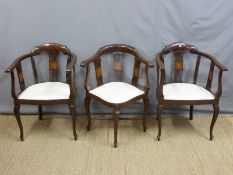 A pair of late 19thC inlaid salon armchairs and a matching corner chair