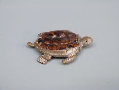 A novelty vesta case in the form of a turtle set with tortoiseshell,