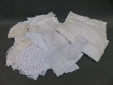 A quantity of linen and lace including baby's hat, pillow cases,