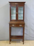 A late 19th / early 20thC display cabinet on stand,