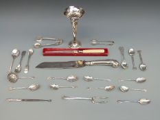 A hallmarked silver vase, sugar nips, golf related spoons, sifter spoon,
