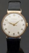 Longines 9ct gold gentleman's wristwatch with gold hands and Arabic numerals,