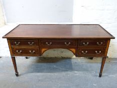 A late 19thC mahogany desk with line inlay decoration,