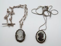 Two silver mounted mother of pearl cameo pendants/ brooches on silver chains