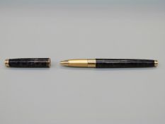 Pelikan Celebry grey marbled ballpoint pen together with a Pilot fountain pen with wood effect