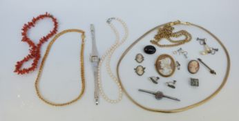 A collection of jewellery to include coral necklace, pearl necklace, silver cameo brooch, watch,
