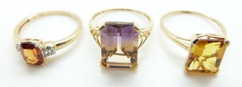Three 9ct gold rings, one set with tourmaline, one citrine and the other citrine and diamonds,