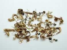 A collection of 9ct gold earrings including hoops, keys, pearls, etc,