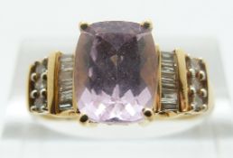 An 18ct gold ring set with a pink topaz and diamonds, size O, 4.