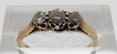 A 9ct gold ring set with three diamonds, size K, 1.