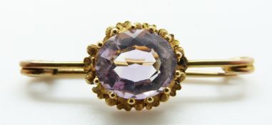 A Victorian brooch set with an amethyst, 3.