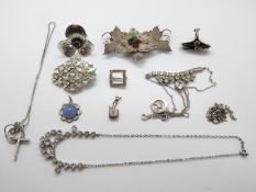 A filigree brooch, two diamanté necklaces,