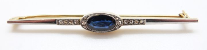 An Art Deco brooch set with an oval sapphire and diamonds with a platinum finish, 4.