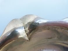 A George V hallmarked silver bowl with lobed crimped rim,