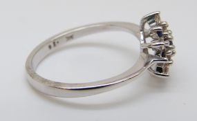 A 9ct white gold ring set with sapphires and diamonds in a cluster, size M, 2.