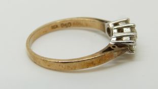 A 9ct gold ring set with three diamonds totalling approximately 0.