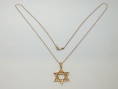A 14k gold pendant (2.7g) and 9ct gold chain (0.