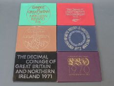 Six brilliant uncirculated Royal Mint coinage sets for Britain and Northern Ireland 1970 - 1975