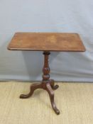 A 19thC mahogany table on a tripod base,