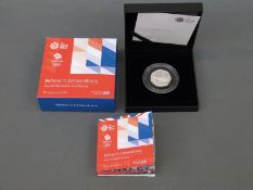 A cased silver proof 2016 Team GB Rio 50 pence coin depicting swimmer,