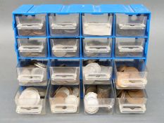 An amateur collection of largely UK coinage in a small collector's cabinet,