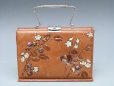 A late 19thC /early 20thC ladies travelling set or case including crochet hooks, scissors,