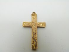 A 9ct gold cross pendant with chased decoration, 1.