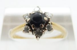 An 18ct gold ring set with a sapphire surrounded by diamonds, size M, 4.