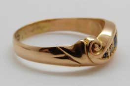 A late Victorian/ early Edwardian 18ct gold ring set with three sapphires and two diamonds, 2.