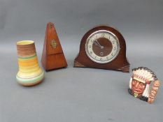 A mahogany metronome, mantel clock,