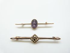 A 9ct gold brooch set with four opals and an emerald and a 9ct gold brooch set with an amethyst, 5.