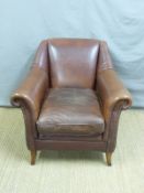 A brown leather arm chair