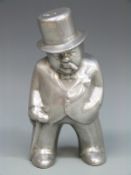 A polished aluminium figure of Sir Winston Churchill,