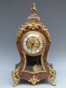 French 19thC mantel clock with Boulle work decoration to front of ebonised balloon style case,