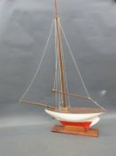 A 1920's vintage pond yacht on wooden stand,