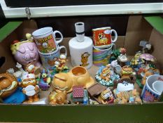 A collection of Garfield ceramics to include Danbury Mint figures, mugs, egg cups, money box,