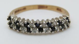 A 9ct gold ring set with sapphires and cubic zirconia, size L/M, 1.