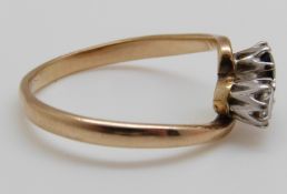 A 9ct gold ring set with a diamond of approximately 0.